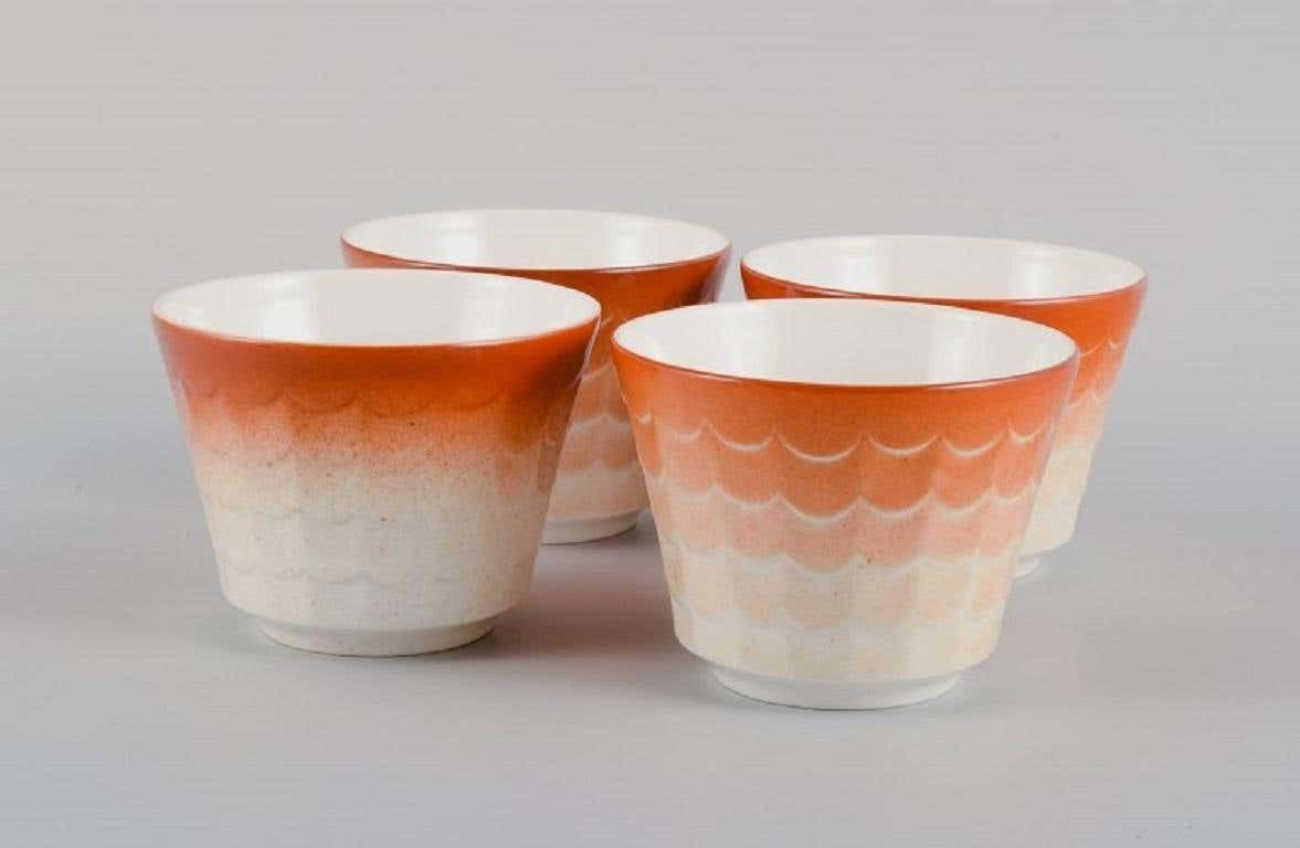 Wilhelm Kåge For Gustavsberg. Four Flower Pot Covers In Porcelain photo furniture