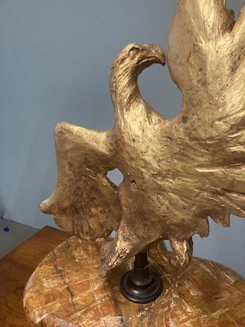 Ancient Eagle Sculpture In Gilded Wood From The 1600s On A Marbled Base photo furniture