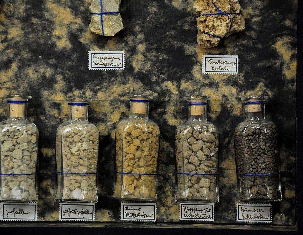 Showcase With Stone Specimen Decomposition Of Rocks Circa 1930 photo Art