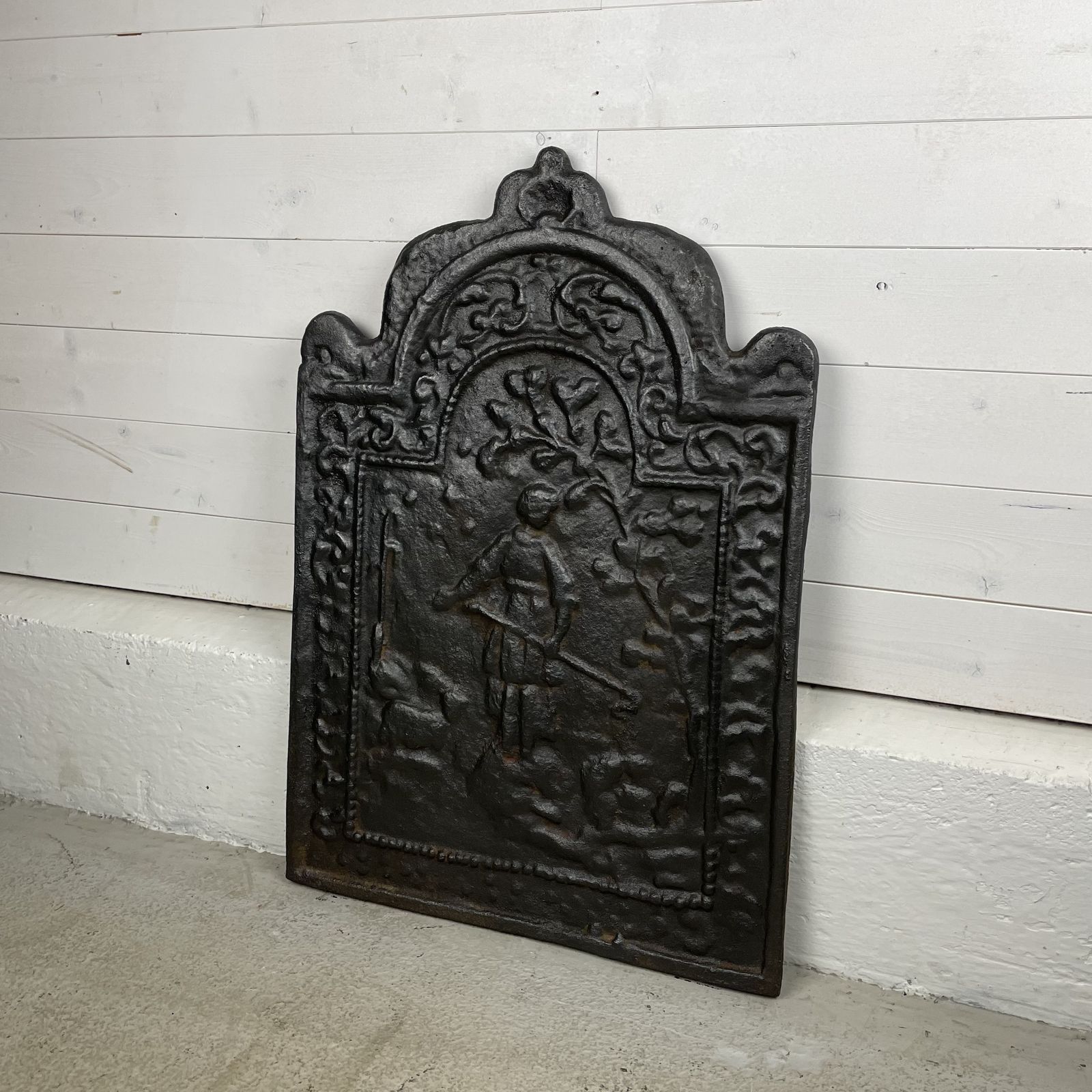 Antique Cast Iron Fire Back With Figure photo for sale