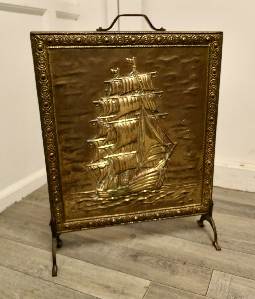 A Large Brass Fire Screen With The Cutty Sark
