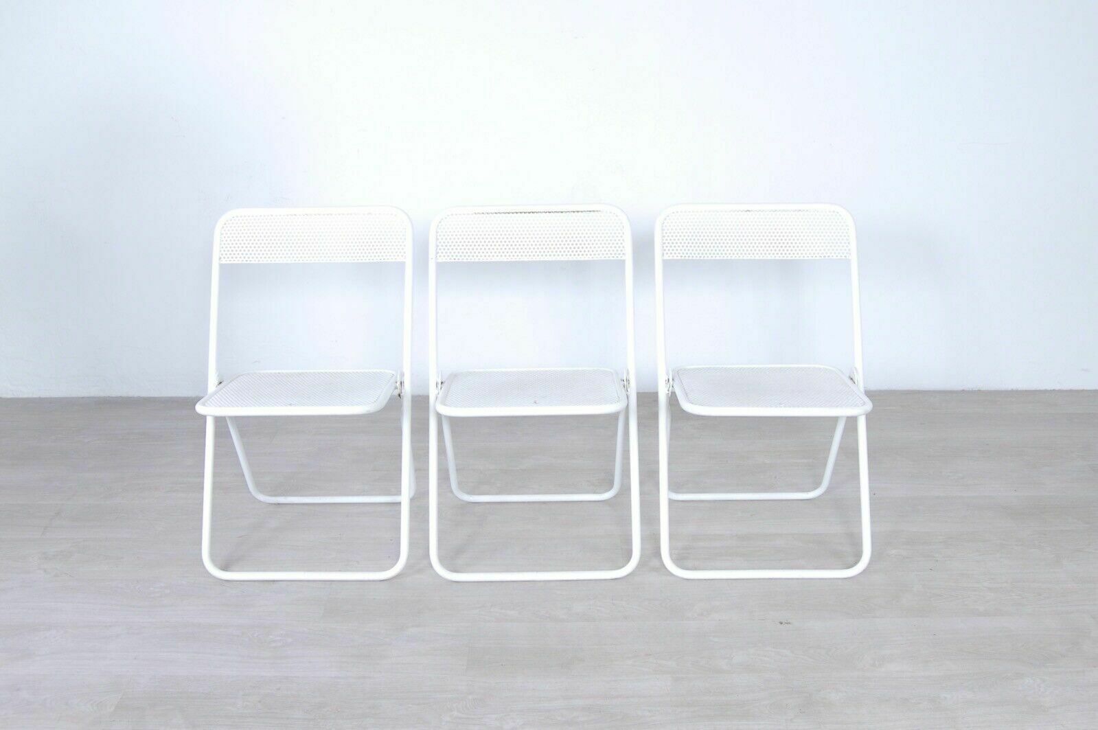 3 Vintage Folding Chairs In Perforated White Enamelled Iron Bar From The 60s And 70s photo furniture