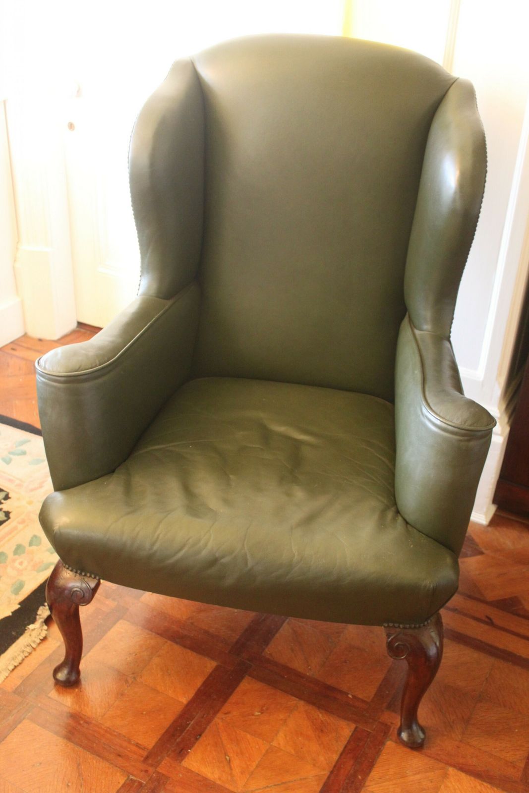 Late 19th/Early 20th Century Queen Anne Style Wing Chair In Green Hide