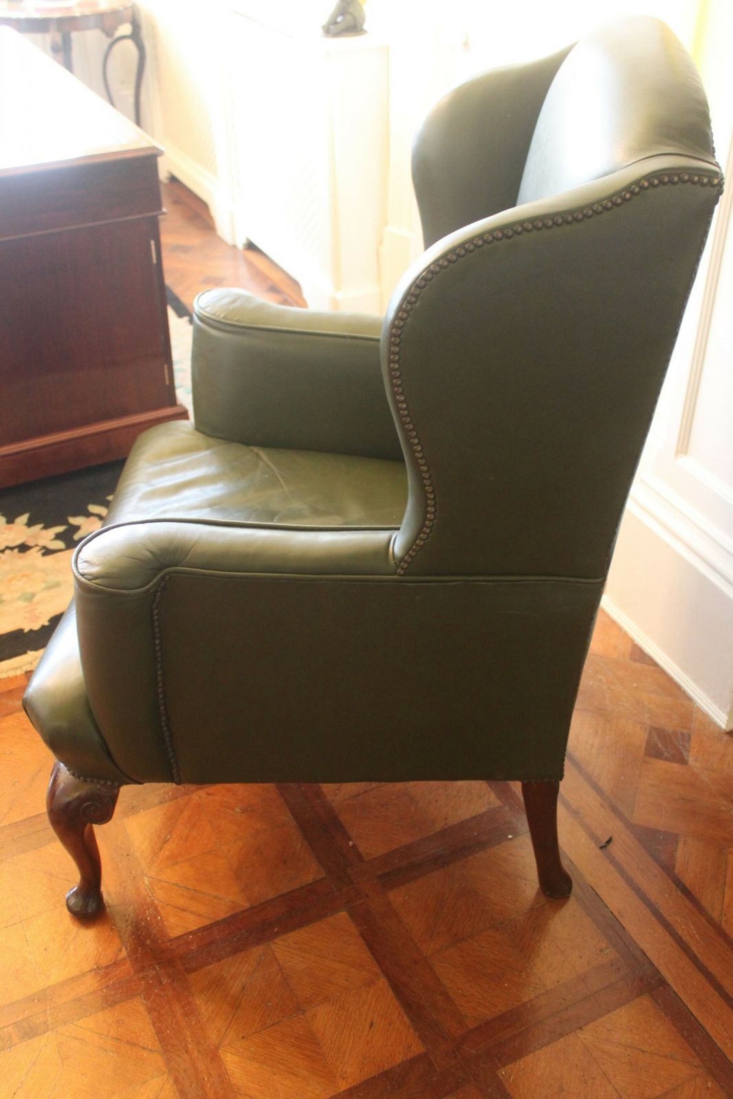 Late 19th/Early 20th Century Queen Anne Style Wing Chair In Green Hide photo for sale
