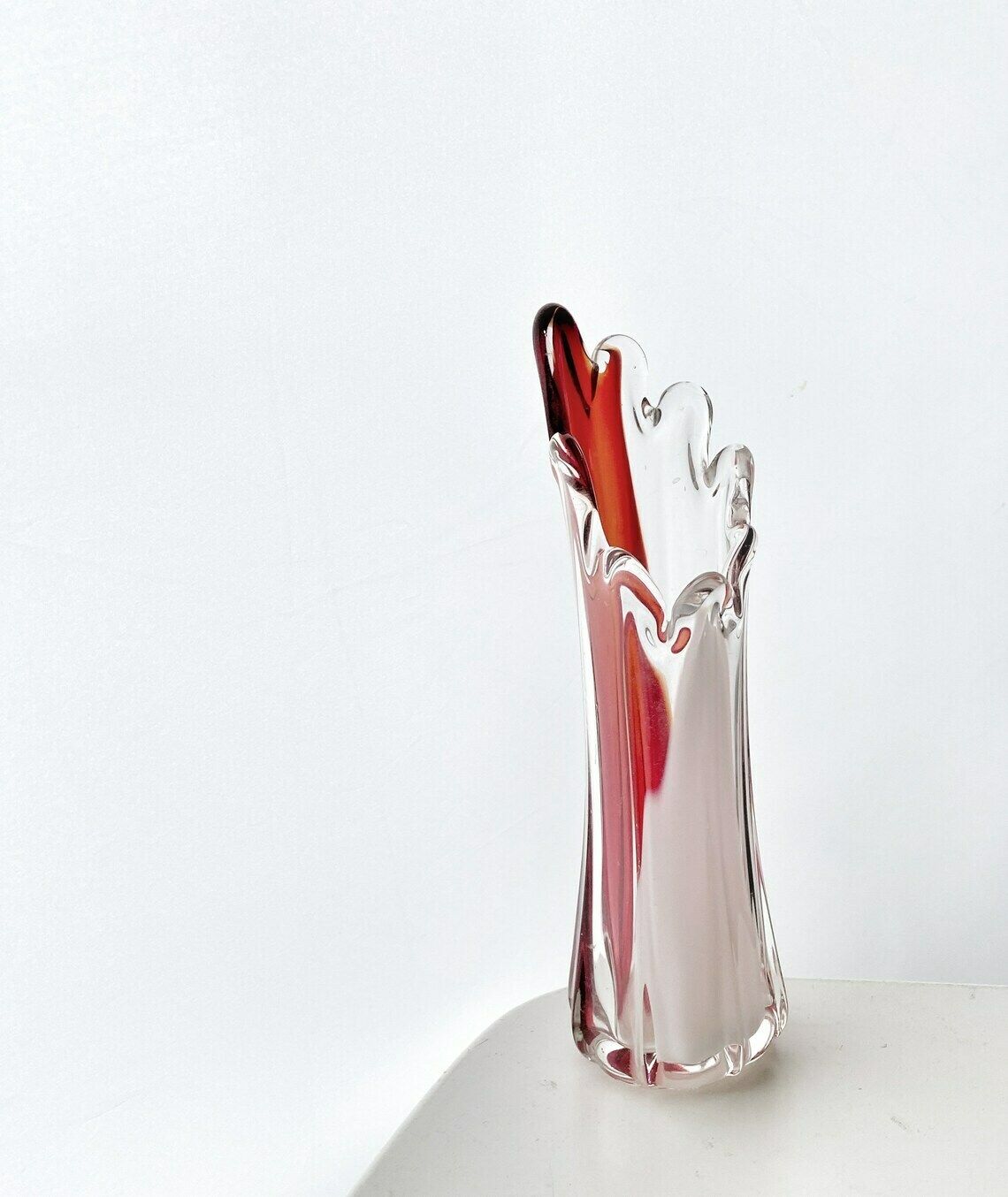 A Murano Art Glass Vase, Organic Form, Clear With White, And Red Tint photo furniture