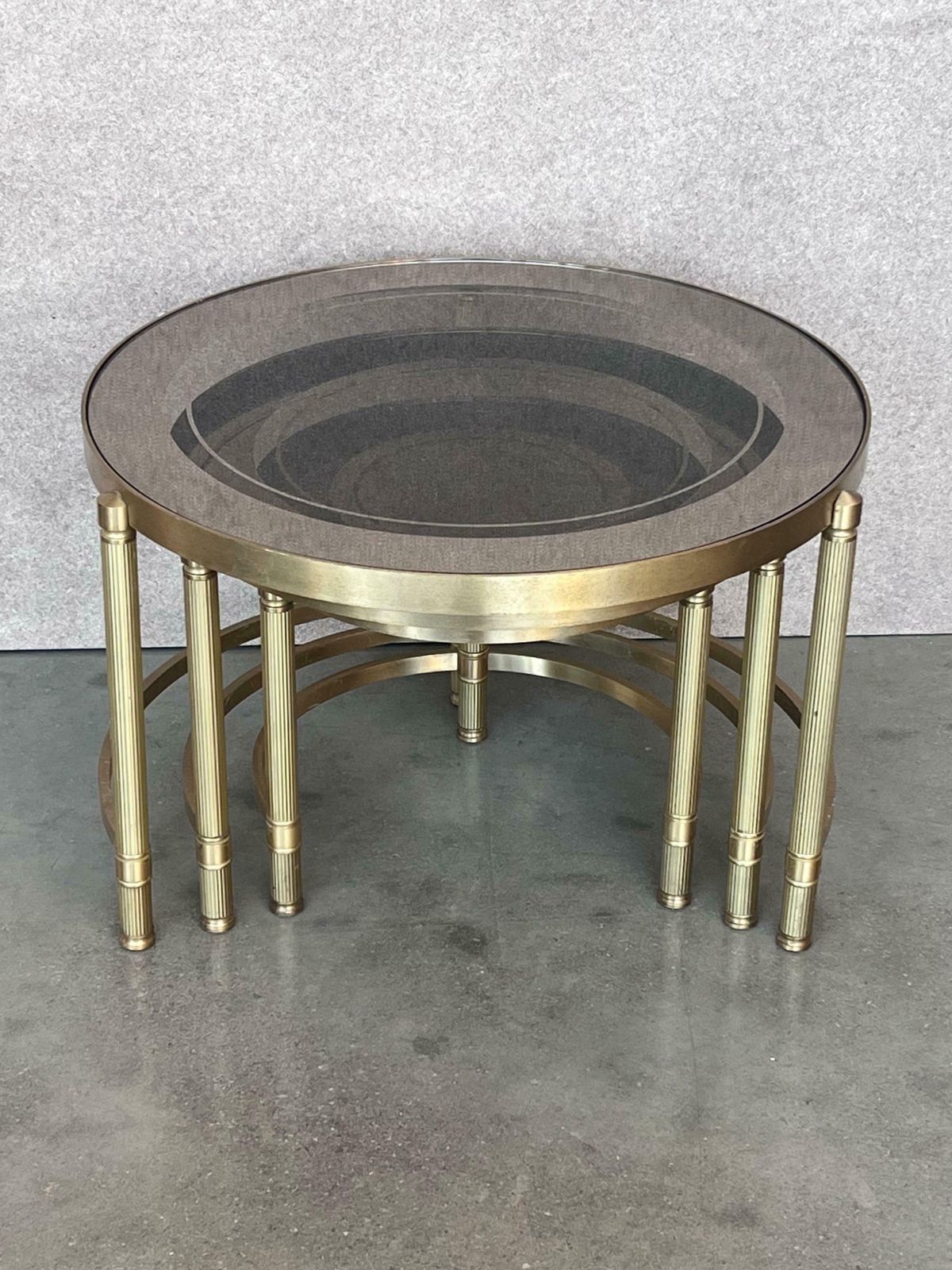 Set Of Three Round Brass Nesting Tables With Smoked Pink Glass Tops photo Furniture