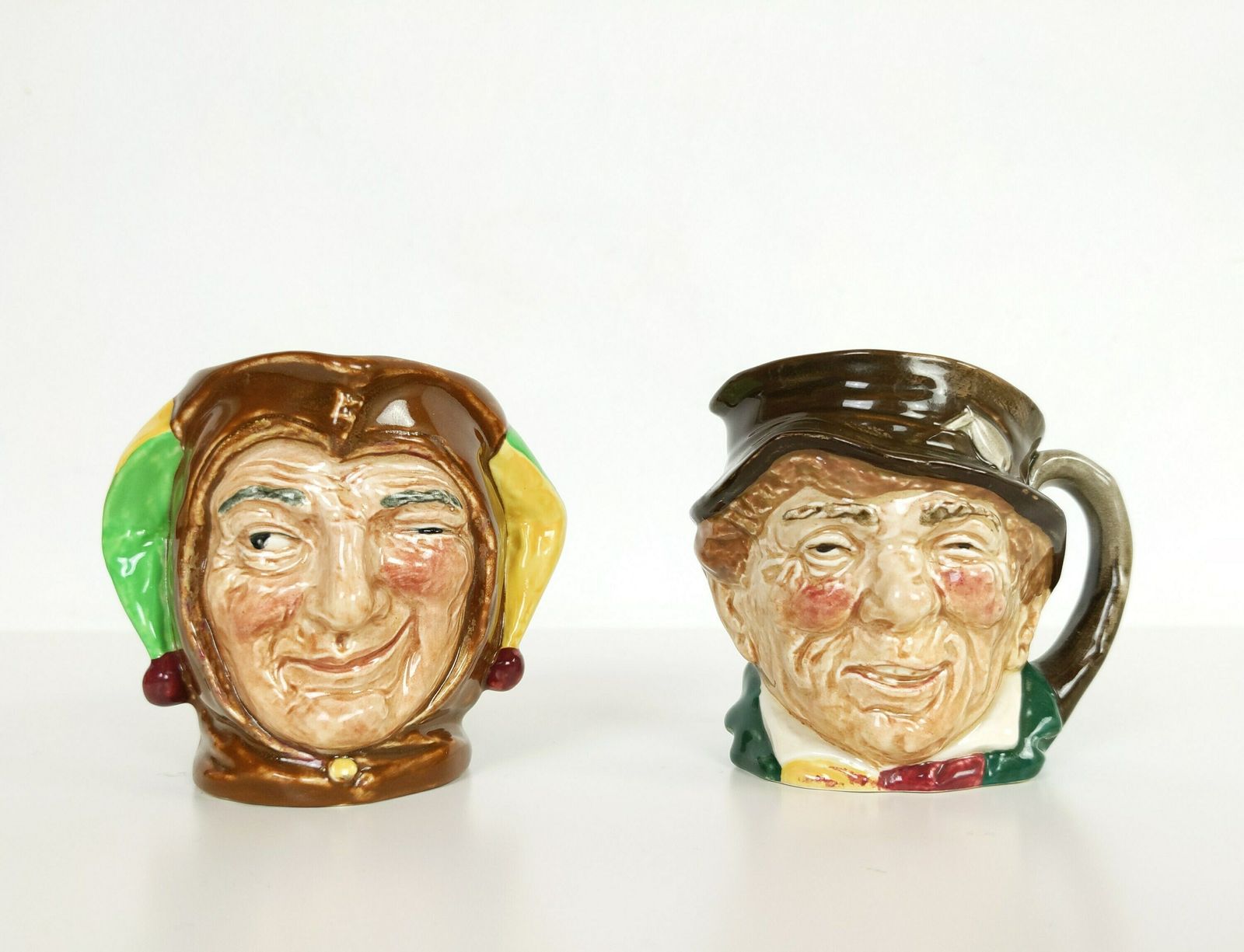 Pair Of British Royal Doulton Pottery Toby Character Jugs Of A Jester And Paddy Made In England With Vintage Makers Stamps