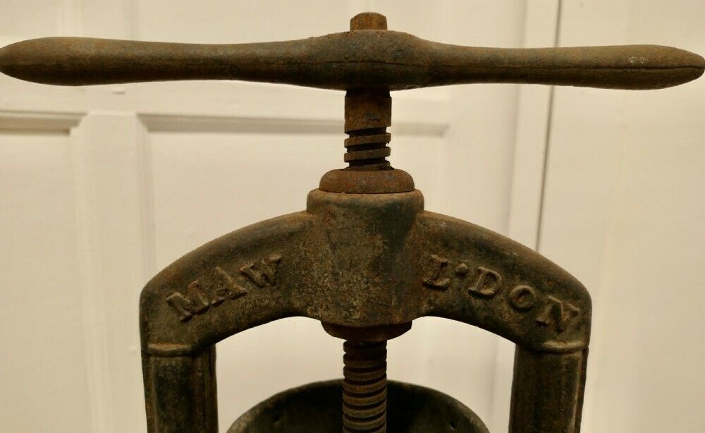 A Maw And Sons 19th Century Cast Iron Tincture Press photo furniture