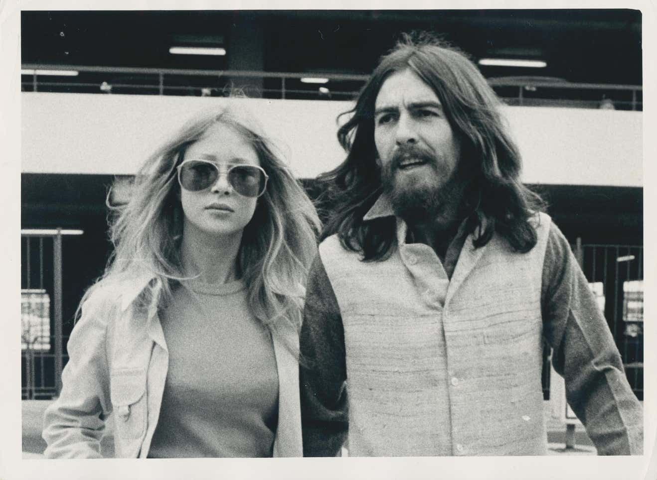 Black And White Photograph Of George Harrison And His Partner