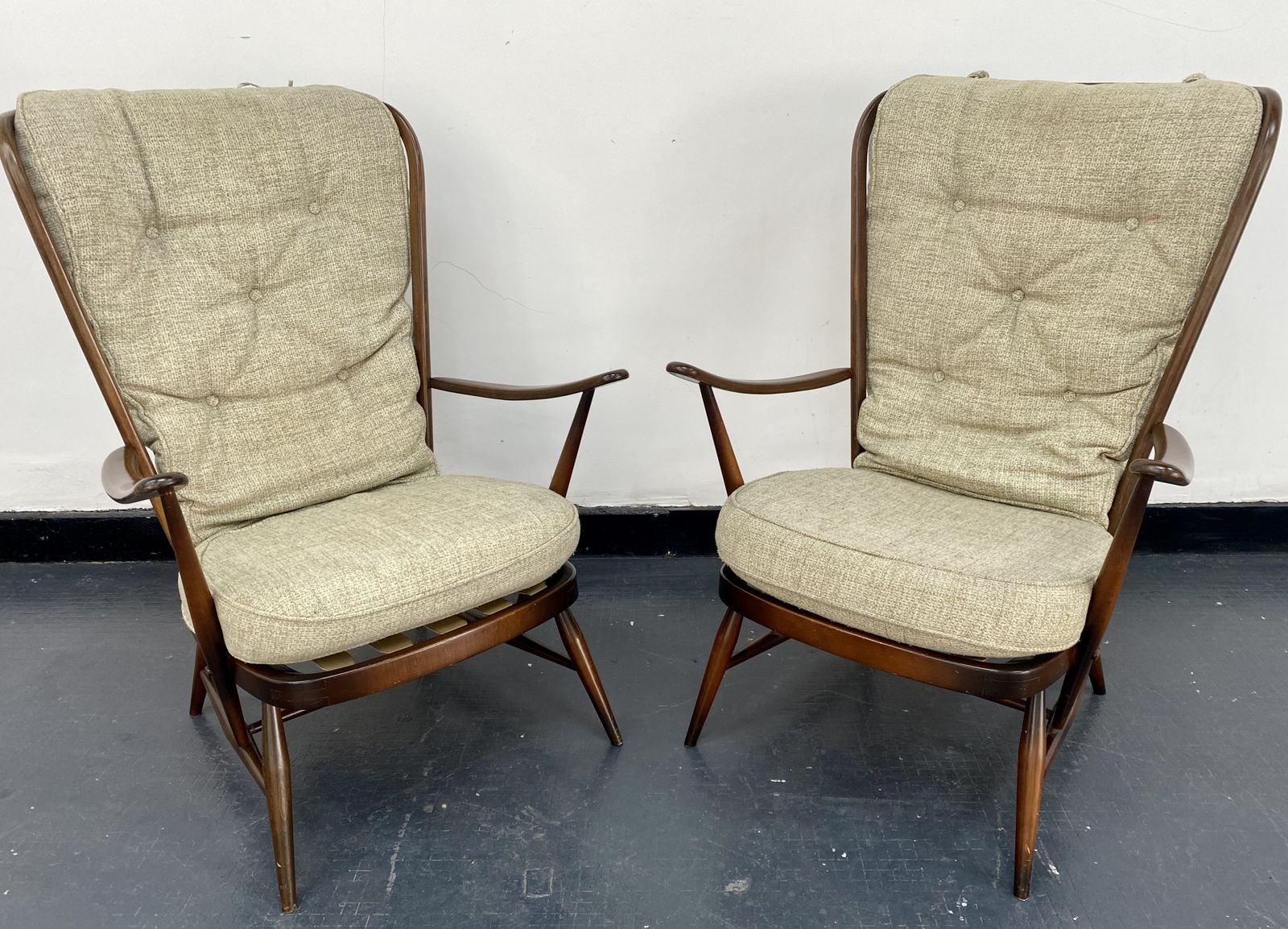 Ercol Tall Back Easy Chairs.