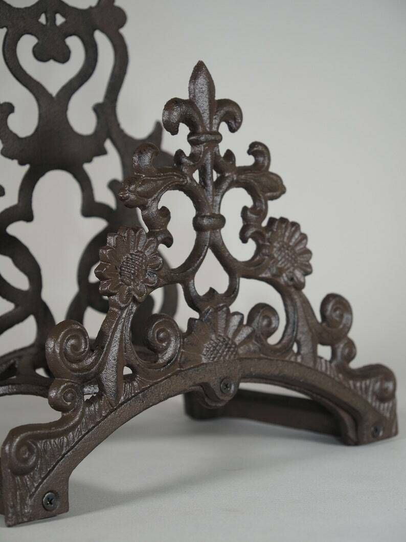 Garden Hose Holder Wall Mounted Lily Cast Iron Wall Mounted Antique Style Hose Holder photo vintage