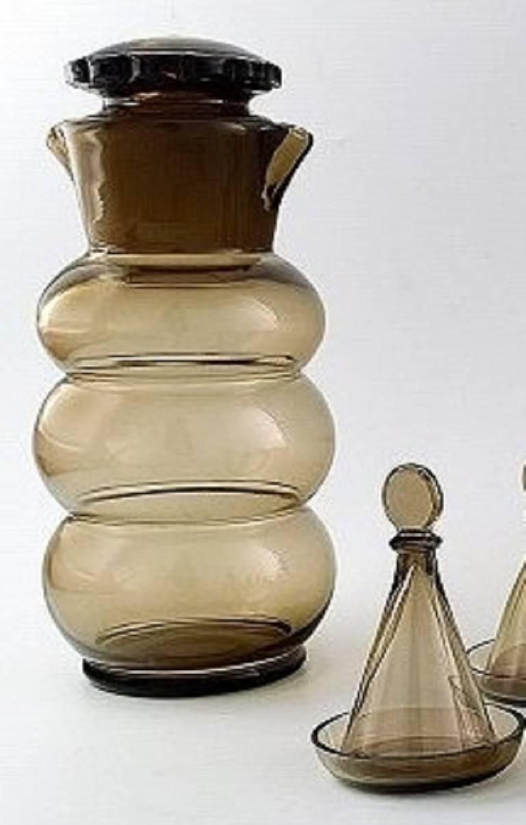 Jacob Bang: "Helan Går". Brown Glass Decanter And Ten Schnapps Glasses photo furniture