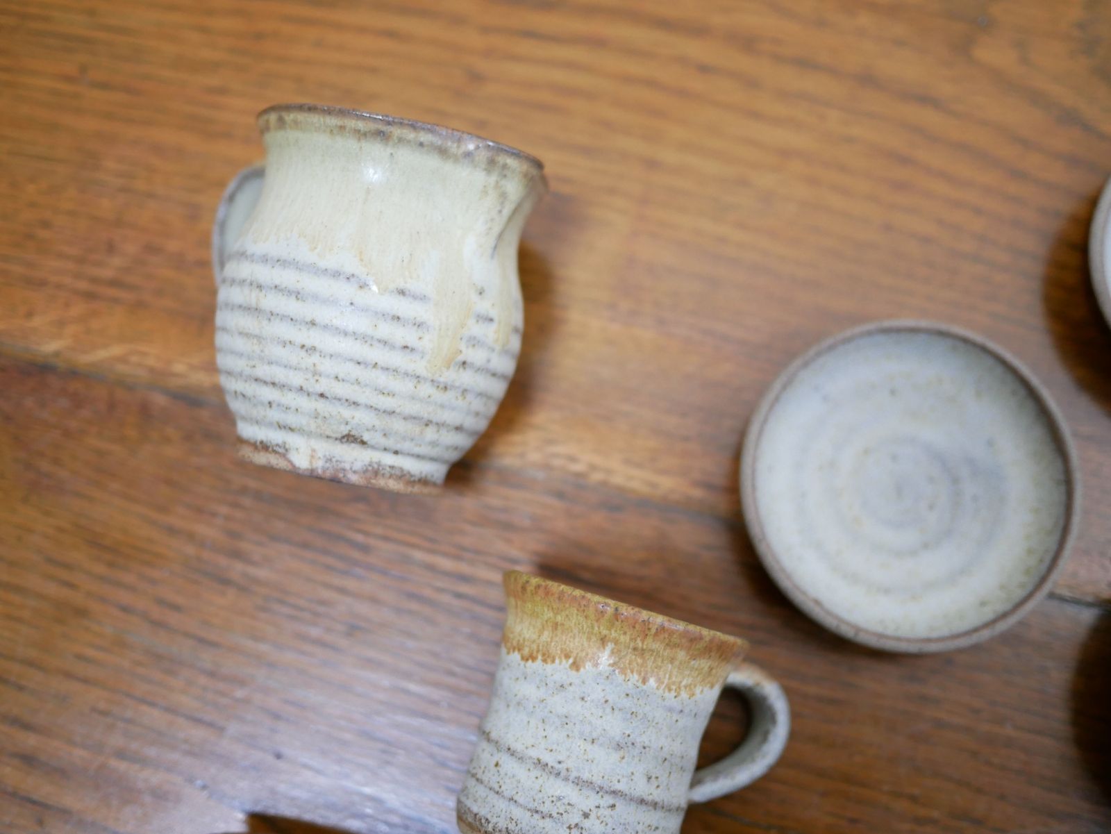 Series Of 4 Cups And A Vintage Sandstone Milk Jug photo furniture