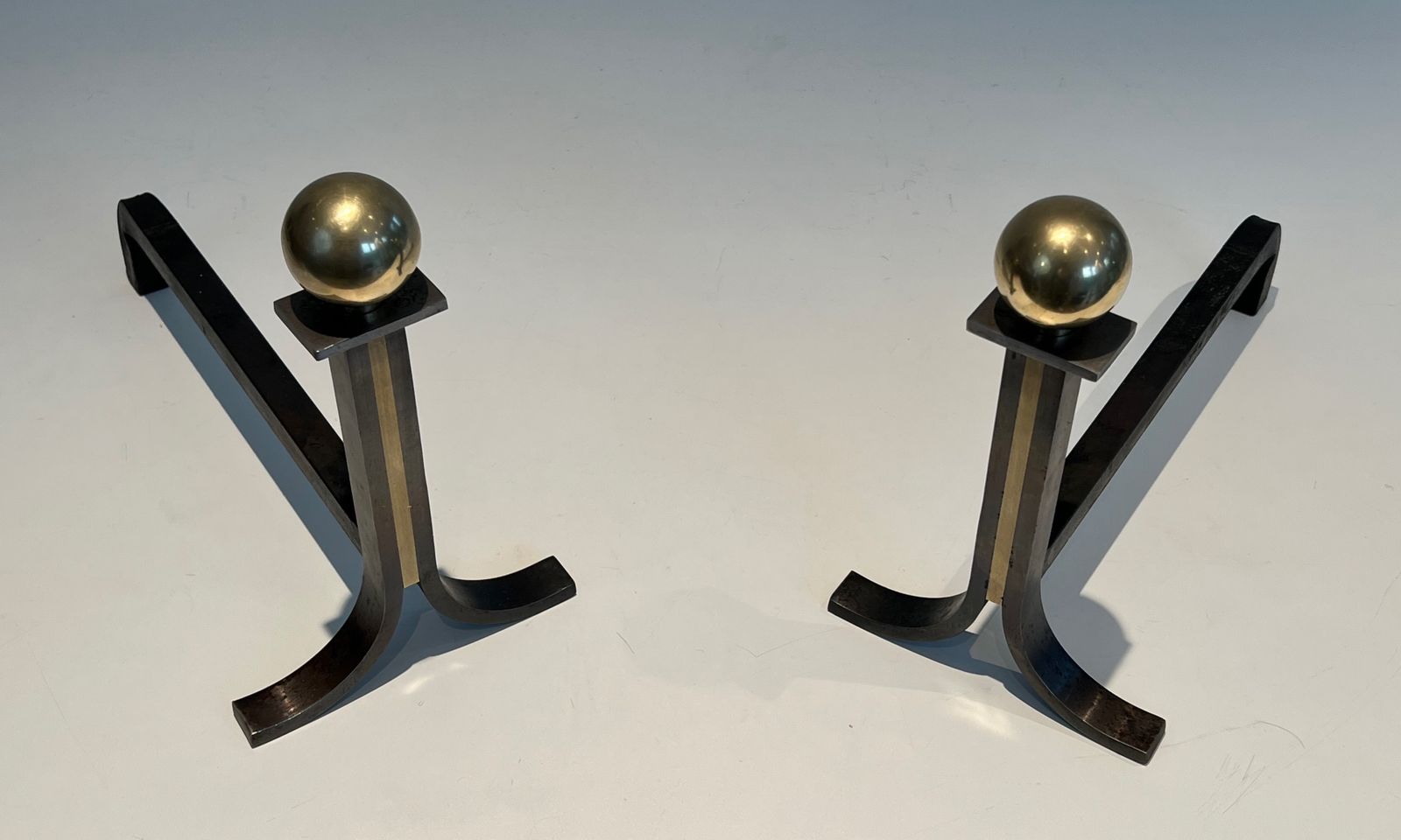Pair Of Modernist Andirons In Steel, Brass And Wrought Iron In The Style Of Jacques Adnet photo for sale