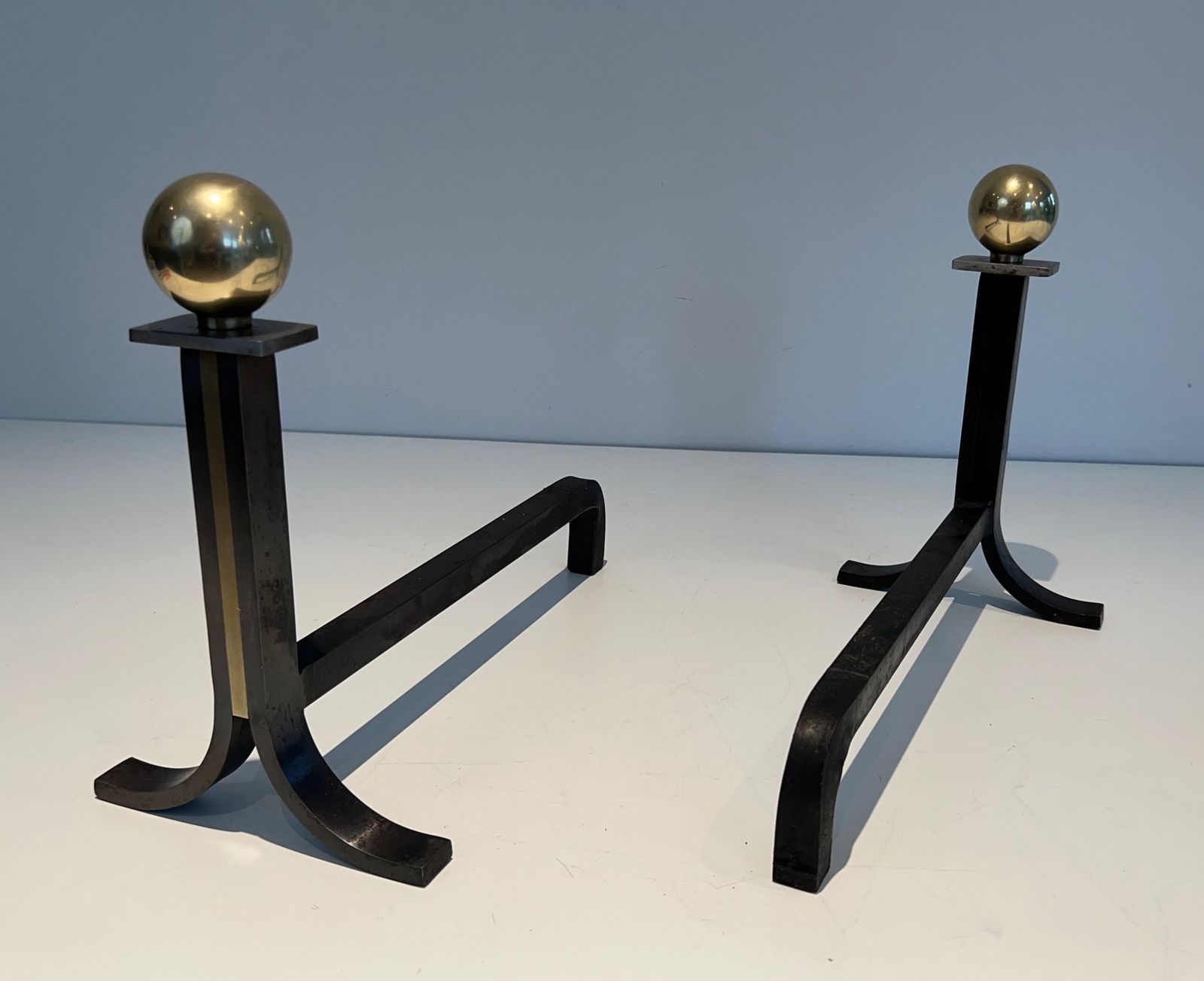 Pair Of Modernist Andirons In Steel, Brass And Wrought Iron In The Style Of Jacques Adnet photo vinterior