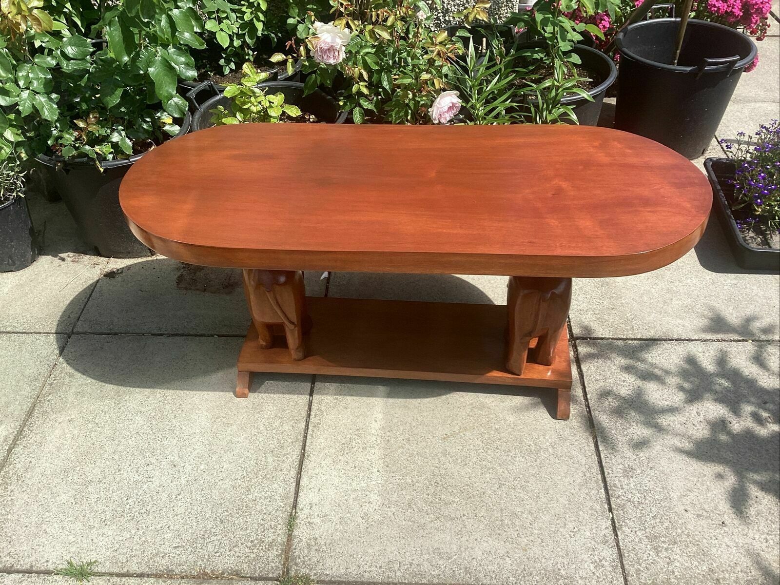 photo vintage 20th C. African Mahogany? Slab Table On Carved Elephant Supports Over Shelf.