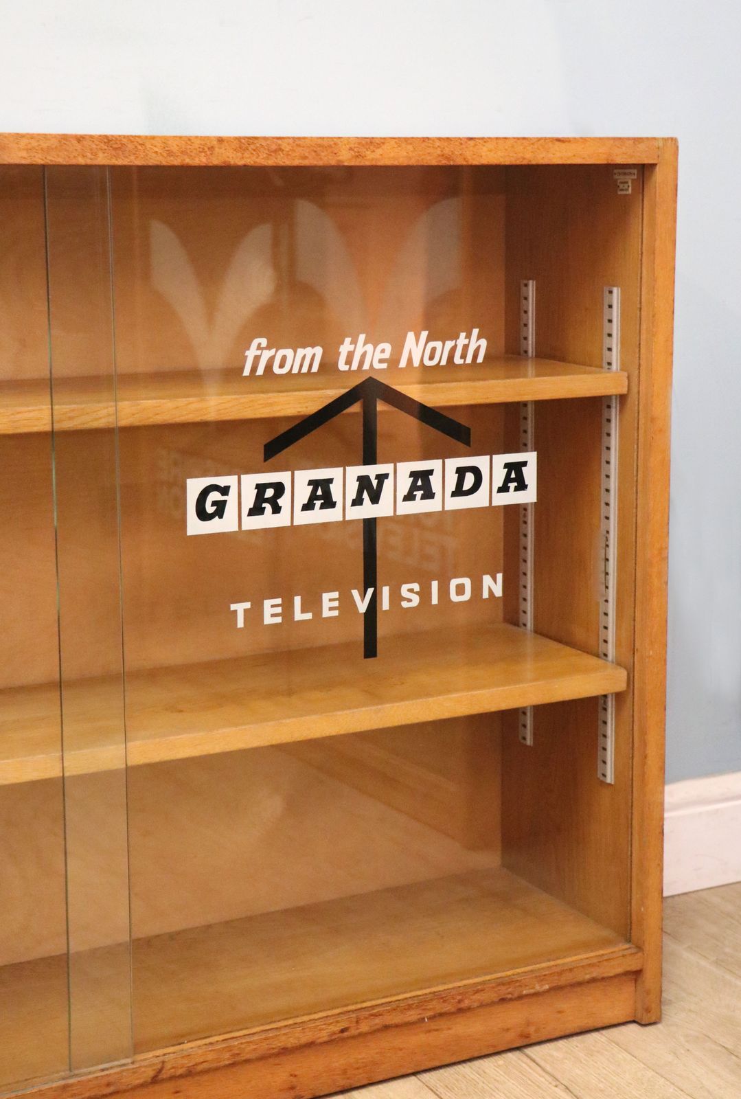 photo furniture A Mid Century Light Oak Veneered Bookcase Later Sign Written For The Granada Television