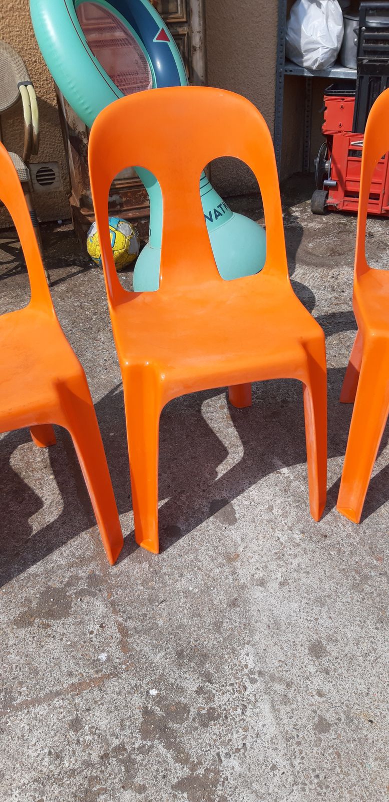 photo furniture 12 Stackable Orange Plastic Chairs