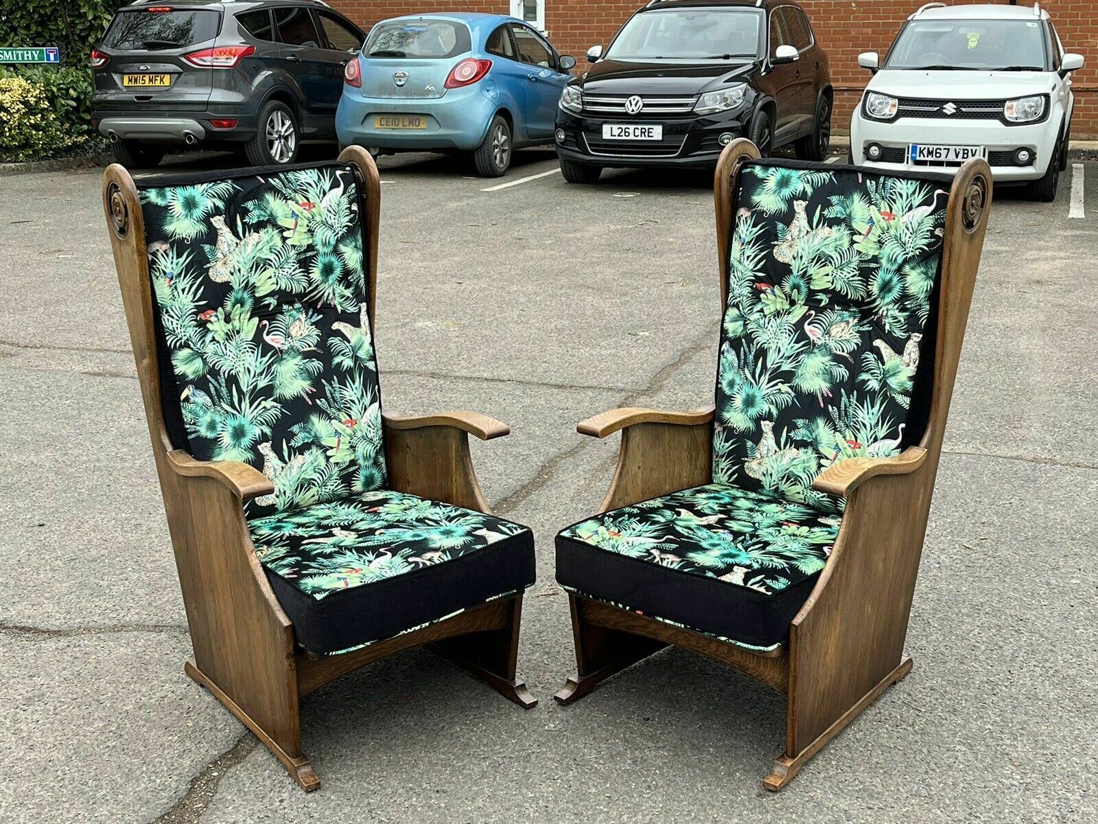 photo buy Mid Century Oak Armchairs Newly Upholstered In A Bright Jungle Print.