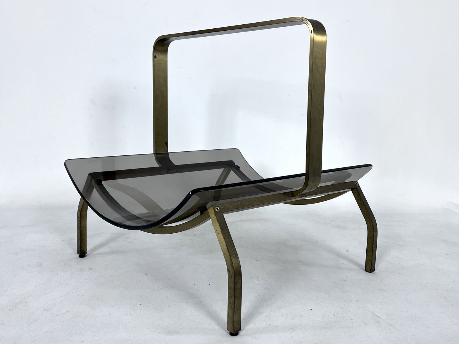 photo for sale Fontana Arte, Mid Century Brass And Curved Glass Magazine Holder. Italy 1960s