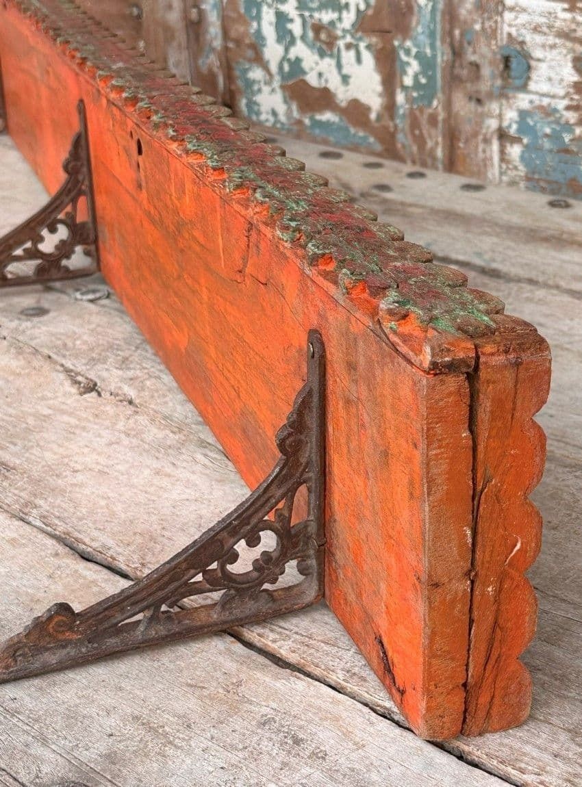 Antique Wooden Panel With Red Paint Tones Made Into A Shelf With Iron Brackets photo furniture
