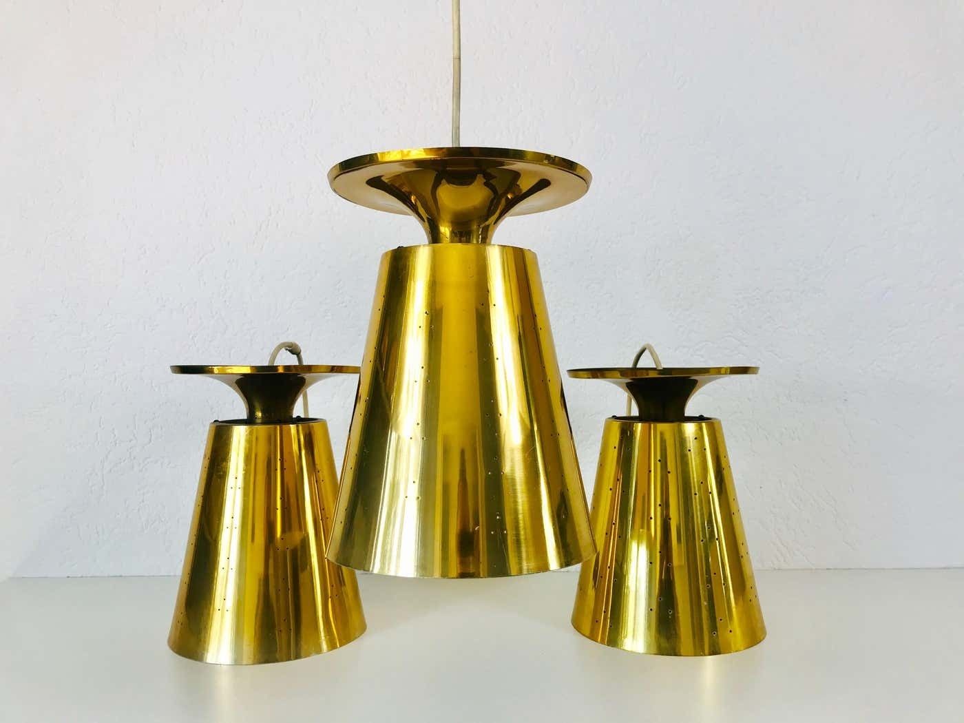 Set Of 3 Polished Brass Pendant Lamps Attributed To Paavo Tynell, 1950s photo furniture