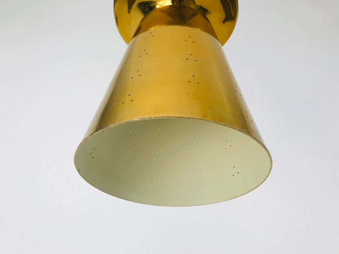 photo buy Set Of 3 Polished Brass Pendant Lamps Attributed To Paavo Tynell, 1950s