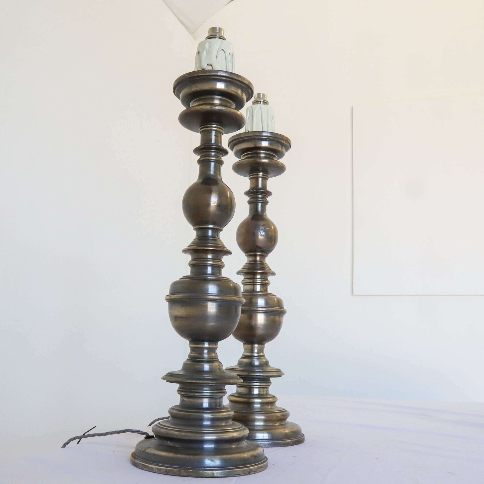 photo for sale Pair Of Silvered Brass Candlesticks Later Converted To Lamps