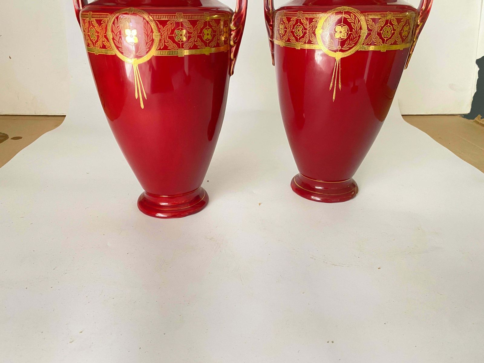 474.0 Pair Of Red Cobalt Urns Vase With Ceramic Handles And Gilted Decorations photo