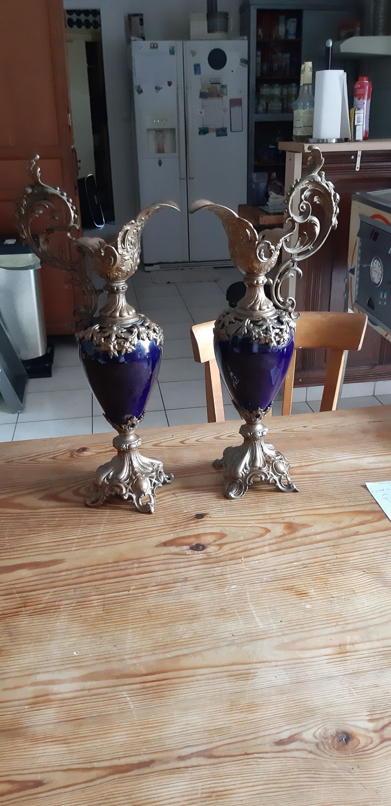 photo vintage Pair Of Golden Spelter And Blue Glass Ewers
