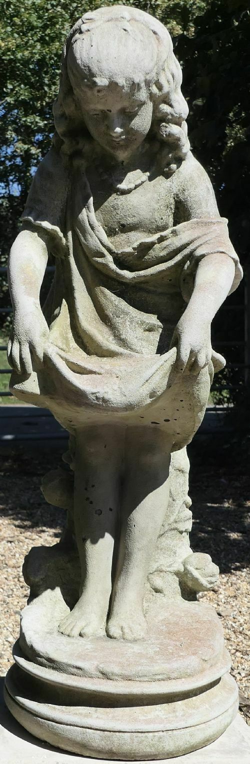 Statue Of A Girl Holding Out Her Apron