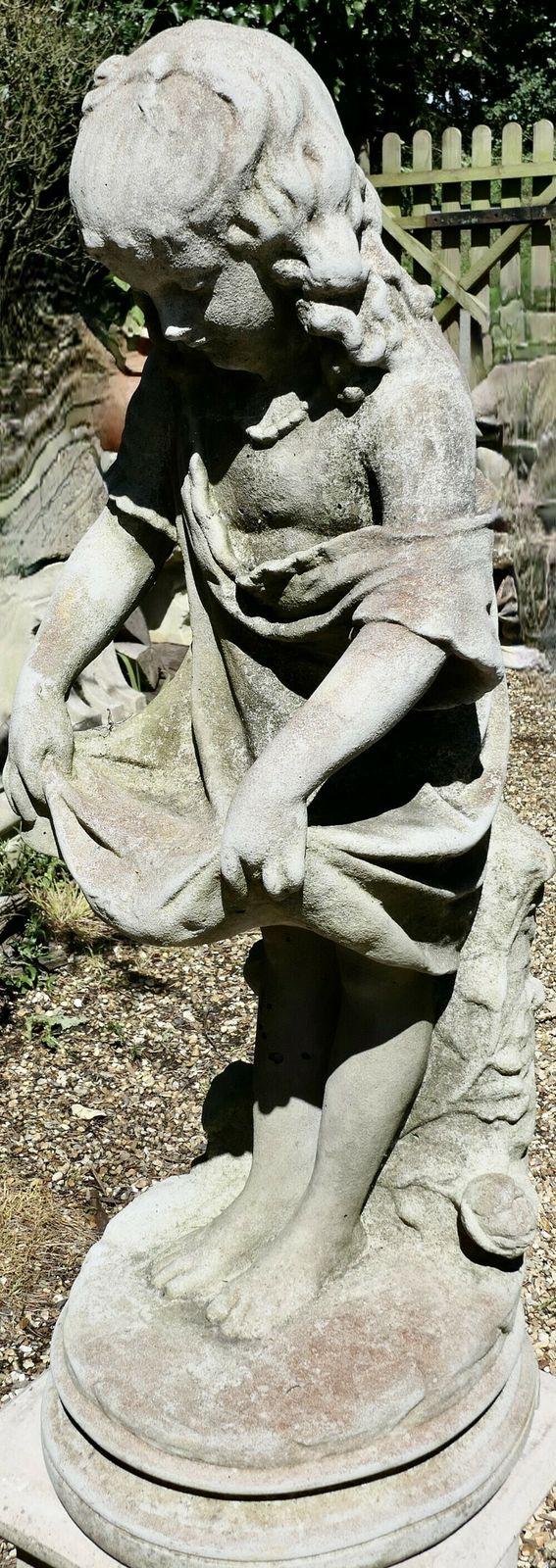 Statue Of A Girl Holding Out Her Apron photo Art