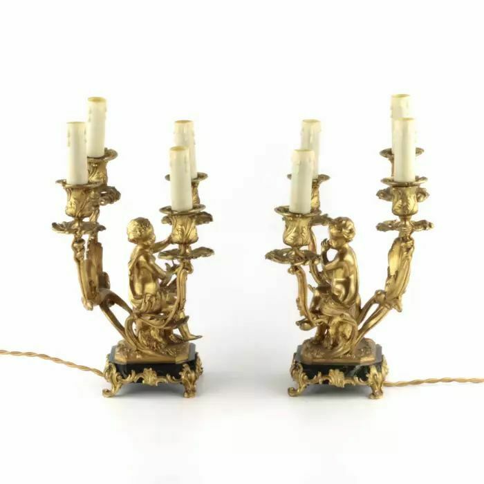 Paired Lamps Of Gilded Bronze With Cupids Playing Music