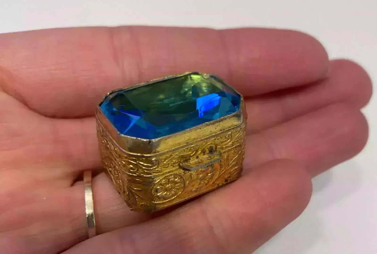 Pill Box Of Gilded Metal, With A Large Blue Stone On The Lid. Early 20th Century. photo for sale