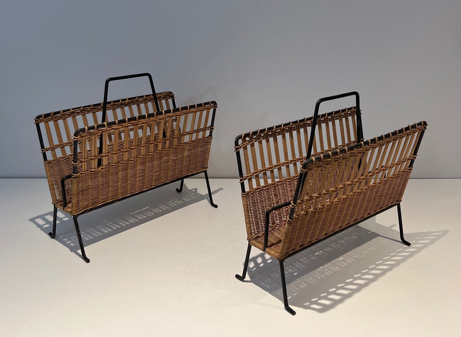 Pair Of Magazine Racks In Black Lacquered Metal And Rattan