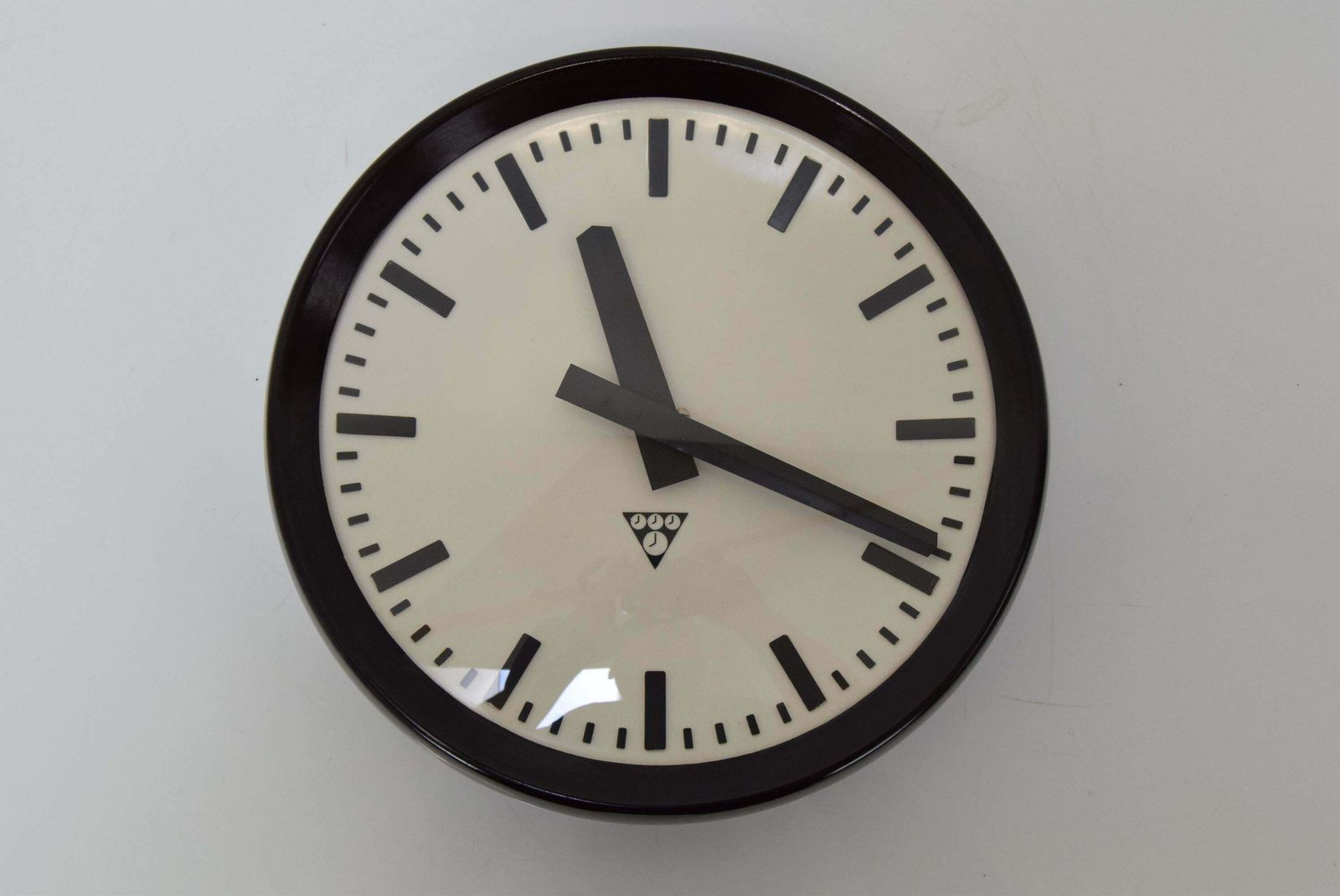 Bakelite Industrial Wall Clock By Pragotron, 1960's. photo for sale