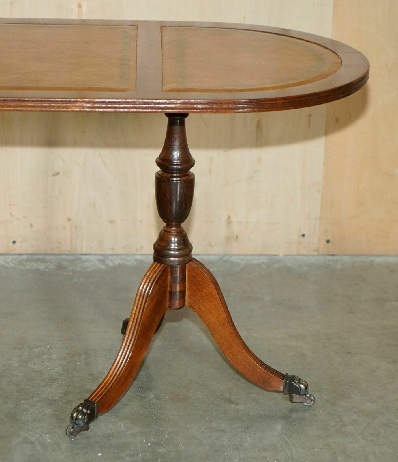 photo buy Vintage Hand Dyed And Aged Brown Leather Oval Coffee Table With Lion Castors