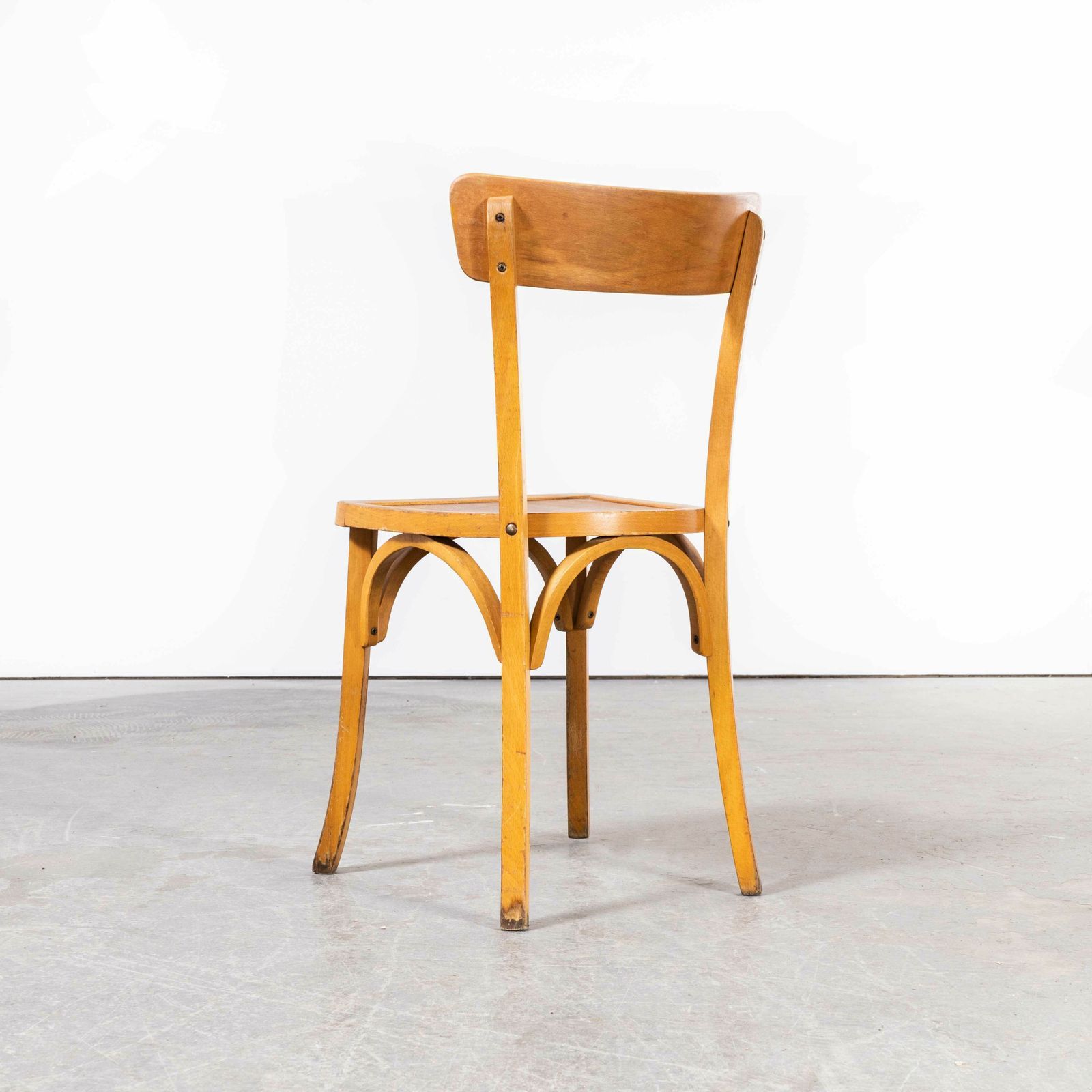 photo furniture 1950’s French Baumann Blonde Kick Leg Bentwood Dining Chairs – Set Of Six