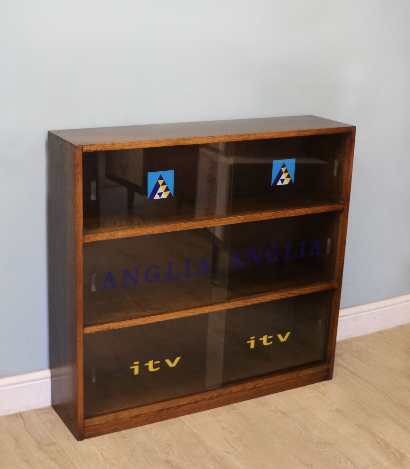 A Lovely Retro Mid Century Display Cabinet Later Sign Written For Anglia Television. photo buy