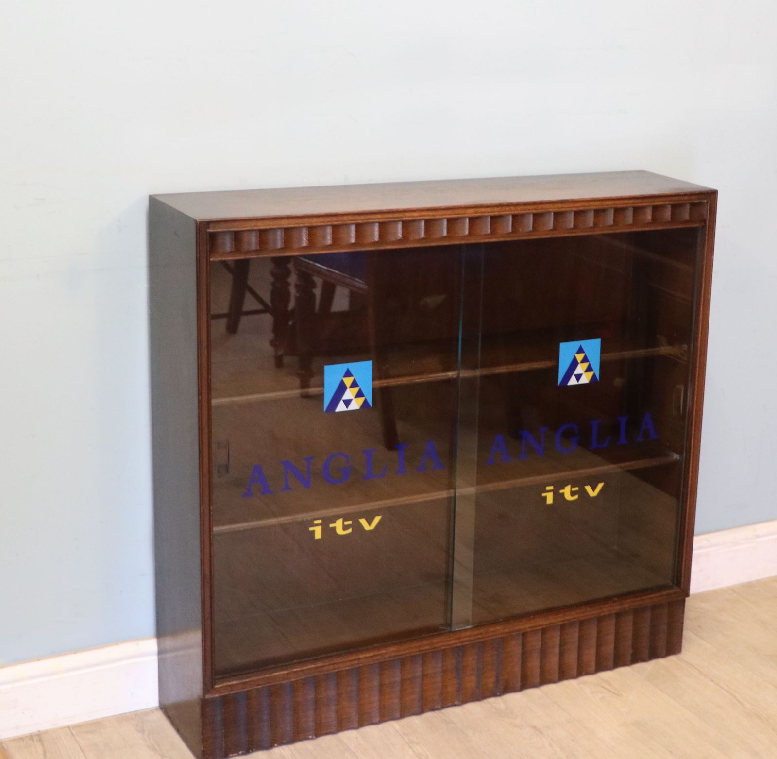 This Lovely Retro Display Cabinet Later Hand Sign Written For Anglia Television. photo furniture