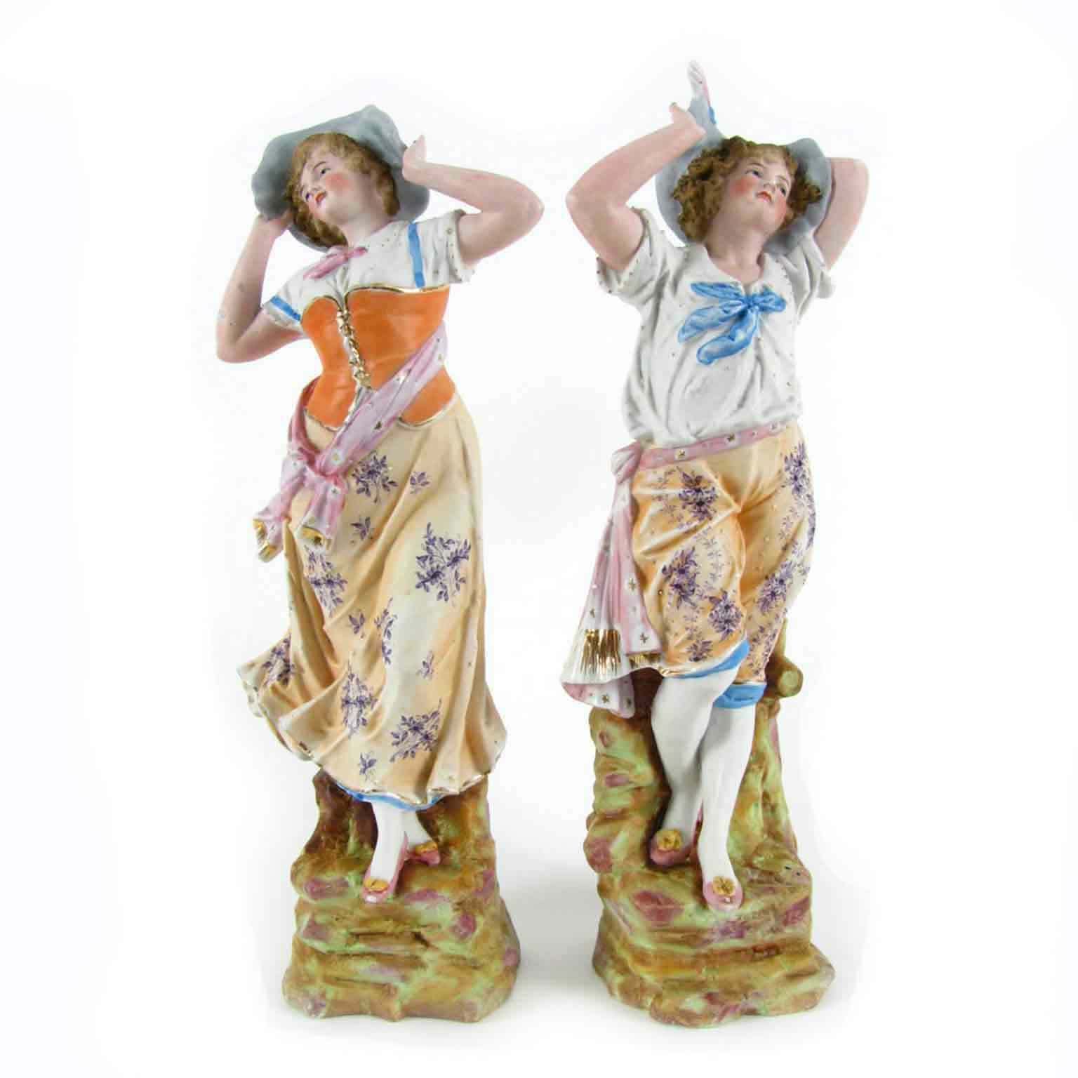 Pair Of Antique Biscuit Porcelain Sculptures
