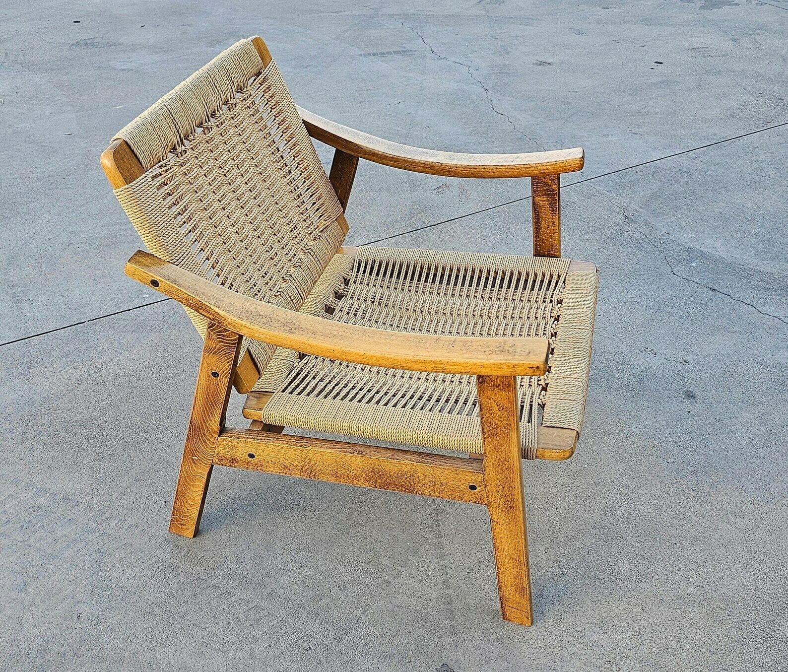 Pair Of Mid Century Modern Armchairs With Ottomans Done In Oak And Danish Paper Cord Done In Hans J. Wegner Style / Made In Yugoslavia In 1960s photo furniture