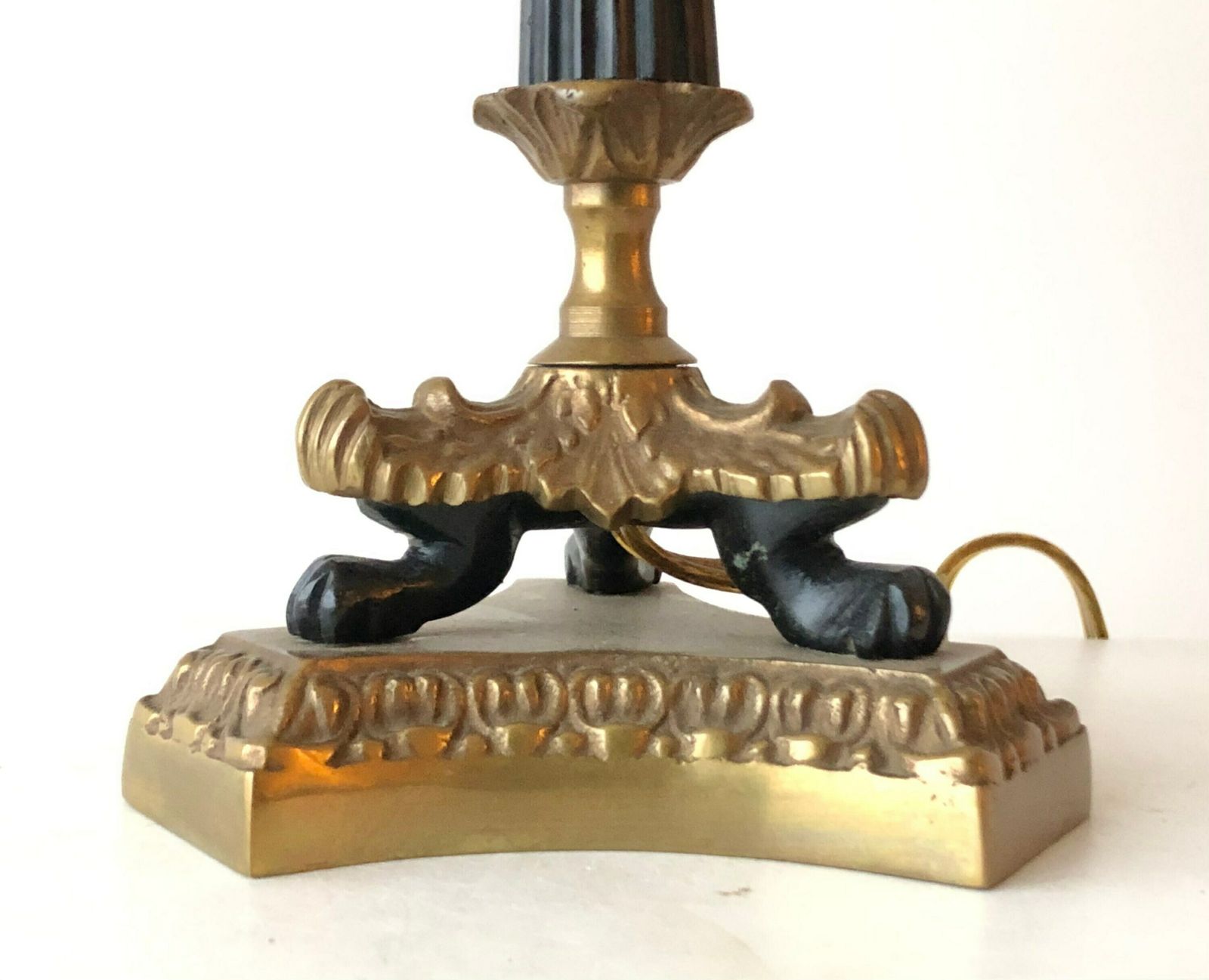 photo furniture Empire Style Tripod Table Lamp In Brass And Black Painted Metal With Organic Shapes, Lion Feet And Off White Fabric Shade With Dots