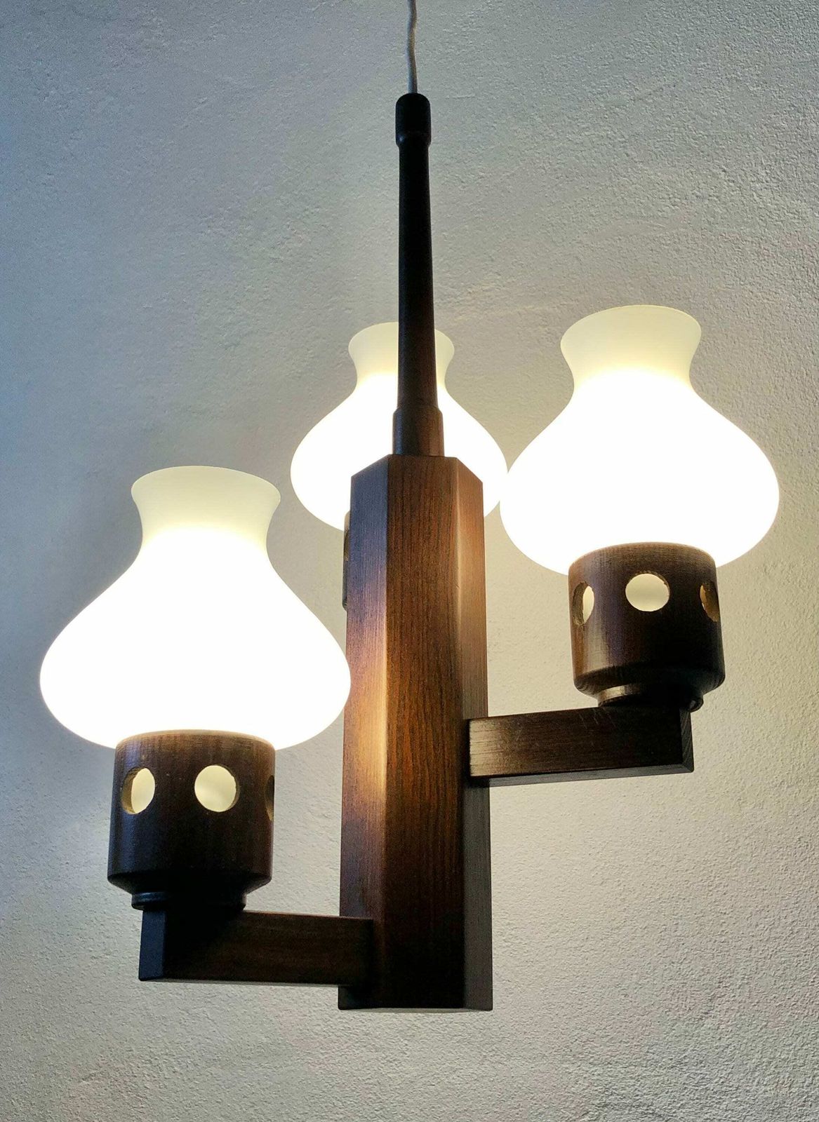 Mid Century Modern Three Armed Design Ceiling Lamp In Dark Toned Wood With Vintage White Glass Torch Shaped Shades
