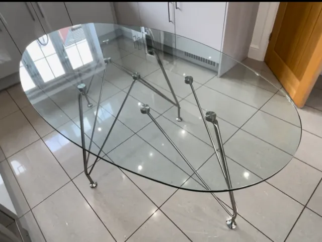 Large Clear Glass Oval Dining Table On Four Chrome Tubular Triple Rod Legs