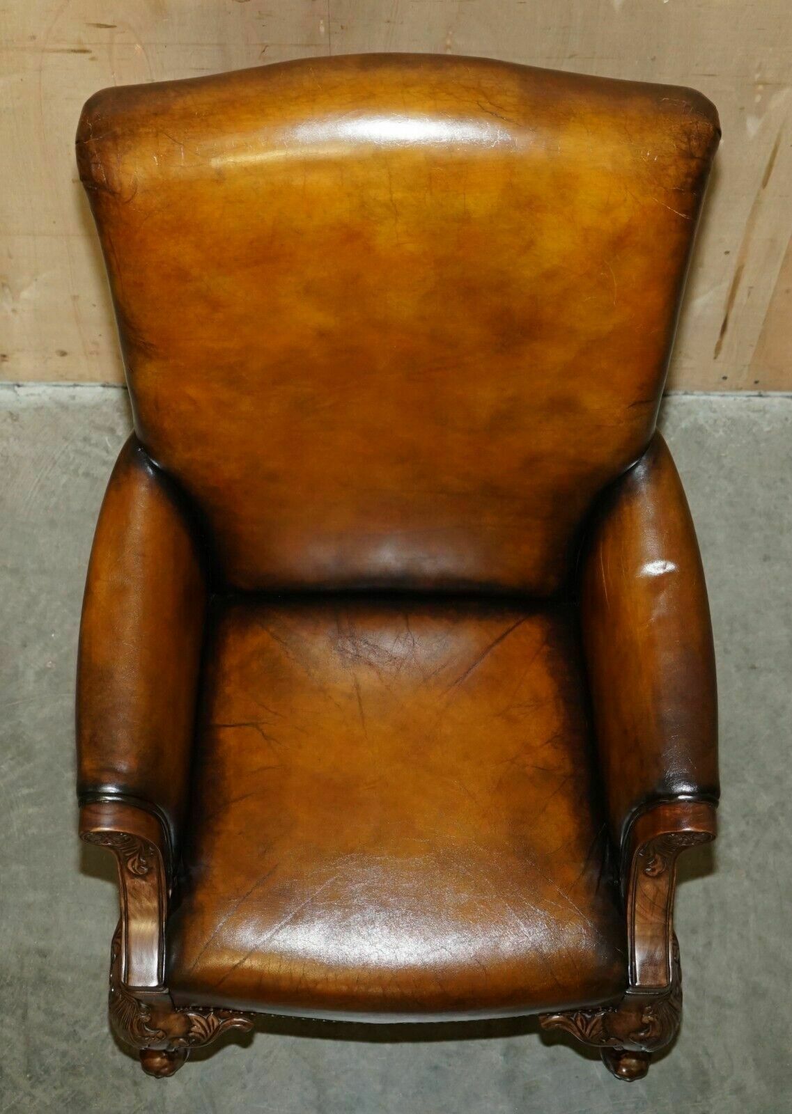 3950.0 Pair Of Antique Heavily Carved Hand Dyed Brown Leather Restored Throne Armchairs photo