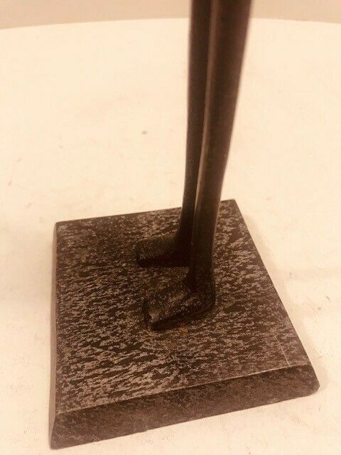 A Metal Statuette Of An African Woman In The Style Of Alberto Giacometti photo furniture
