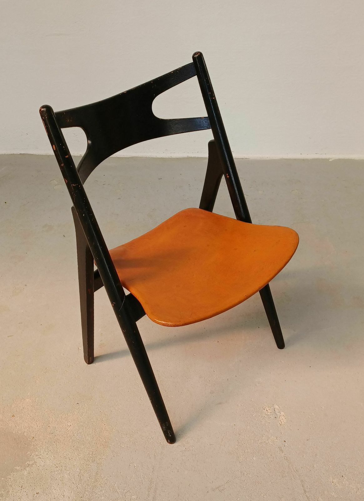Patinated Hans Wegner Sawbuck Chair With Original Leather 1950s photo for sale