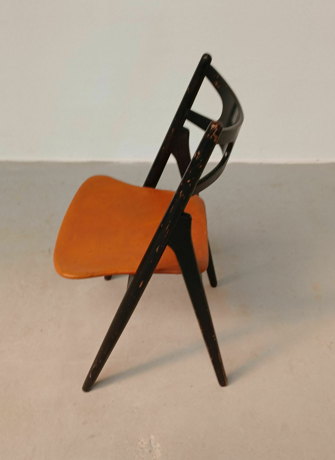 Patinated Hans Wegner Sawbuck Chair With Original Leather 1950s photo vintage