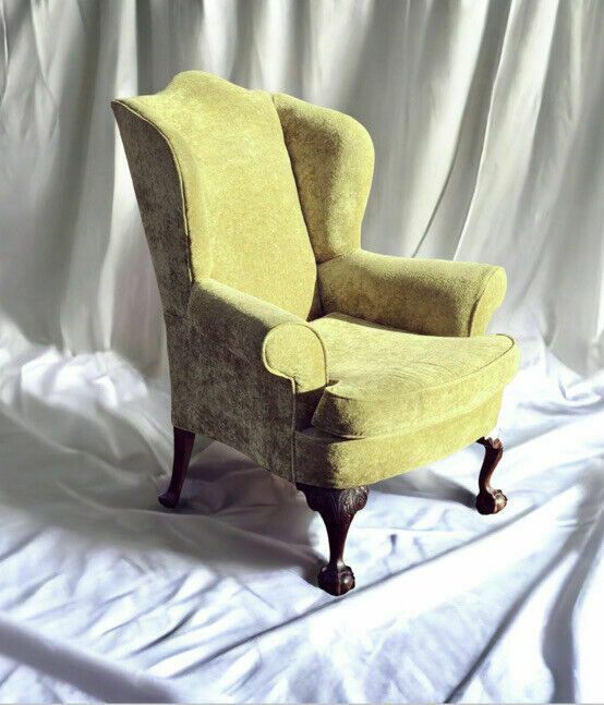 photo furniture Antique Libra Armchair. Fine Carved Mahogany Legs.